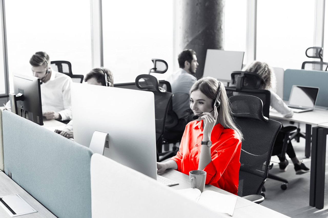 Lady providing first line support over the phone.